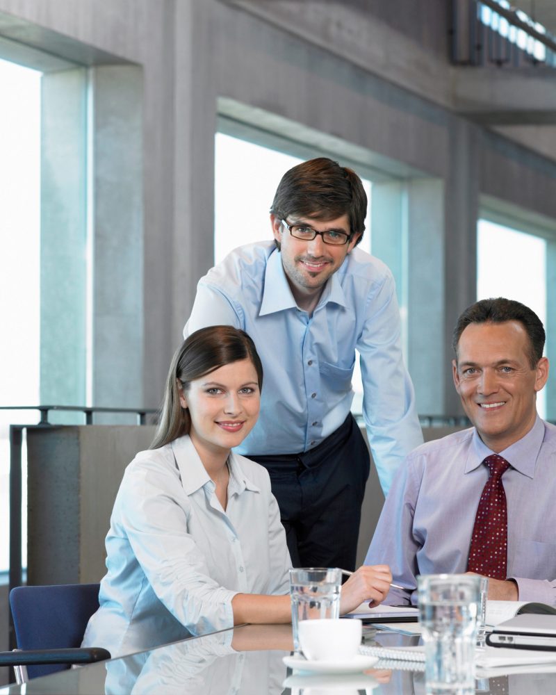 three businesspeople at table 2023 11 27 04 53 20 utc scaled